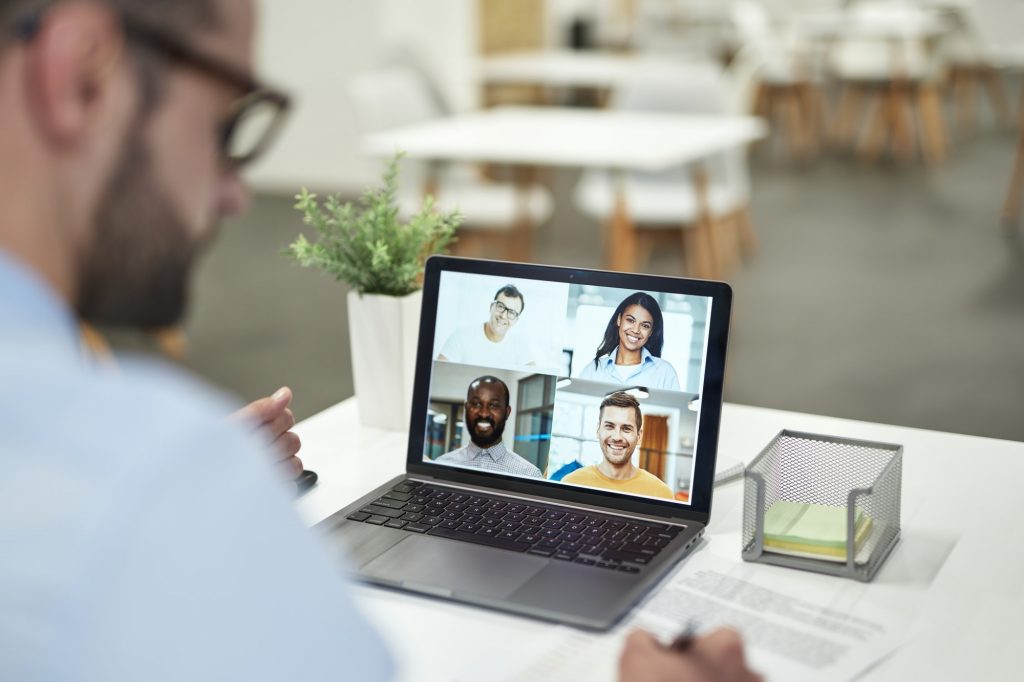Boss listening to the employees at the online meeting